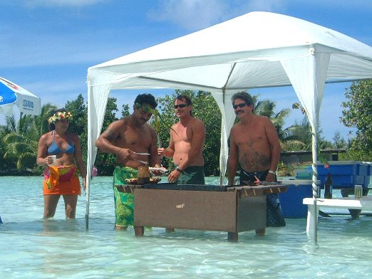 Picnic in the Lagoon Marc and is staff preparing our Picnic in the Lagoon - French Polynesia - April 2004