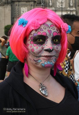 Zocalo Square La Catrina became a strong symbol for the numerous Day of the Dead activities. Women paint their faces in colorful make-up and dress with elegant outfits...