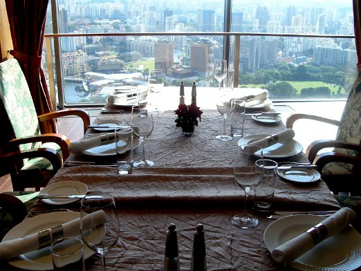 singapore-2 Can you imagine having dinner with this million dollar view by night ? Pictured from the Stamford's Hotel 70th floor - Singapore - August 23, 2007
